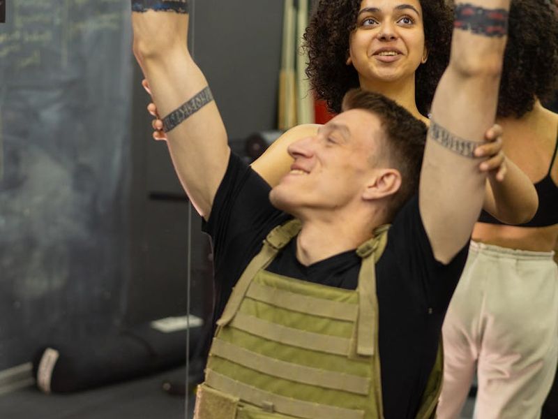 Close up of a man's hands gripping a pull-up bar firmly